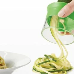OXO Good Grips 3 Blade Hand Held Spiralizer- Makes 3 Different Noodles -Outlet Utensils Store hand held spiralizer with plate of spaghetti 11194200